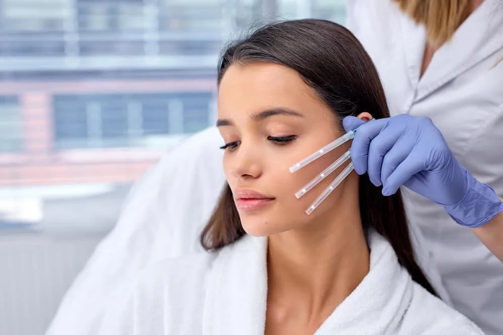 Medical professional performing MINT™ PDO thread lift on patient’s midface at Ageless Health Institute in Phoenix to lift and tighten skin naturally.