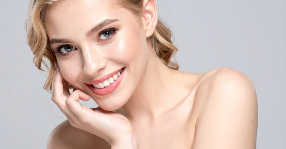 Woman with smooth radiant skin after a facial treatment