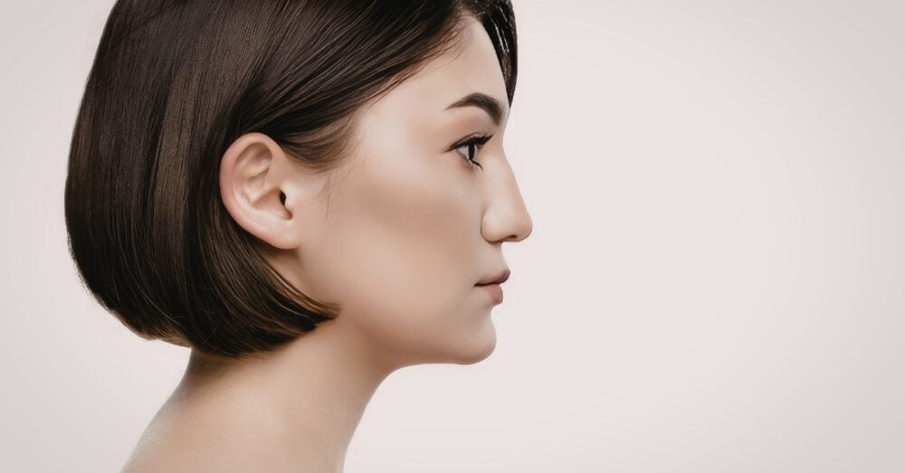Side profile of a woman with a smooth, defined jawline illustrating the potential results of masseter Botox treatment