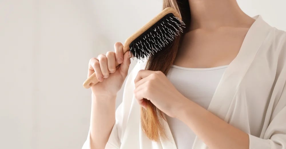 Woman brushing her hair