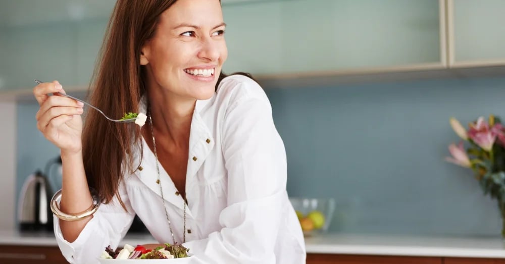 Woman smiling while looking to the side