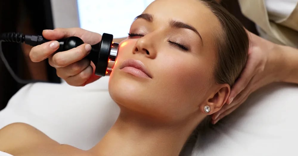 Patient receiving a light-based facial skin treatment at a Phoenix med spa